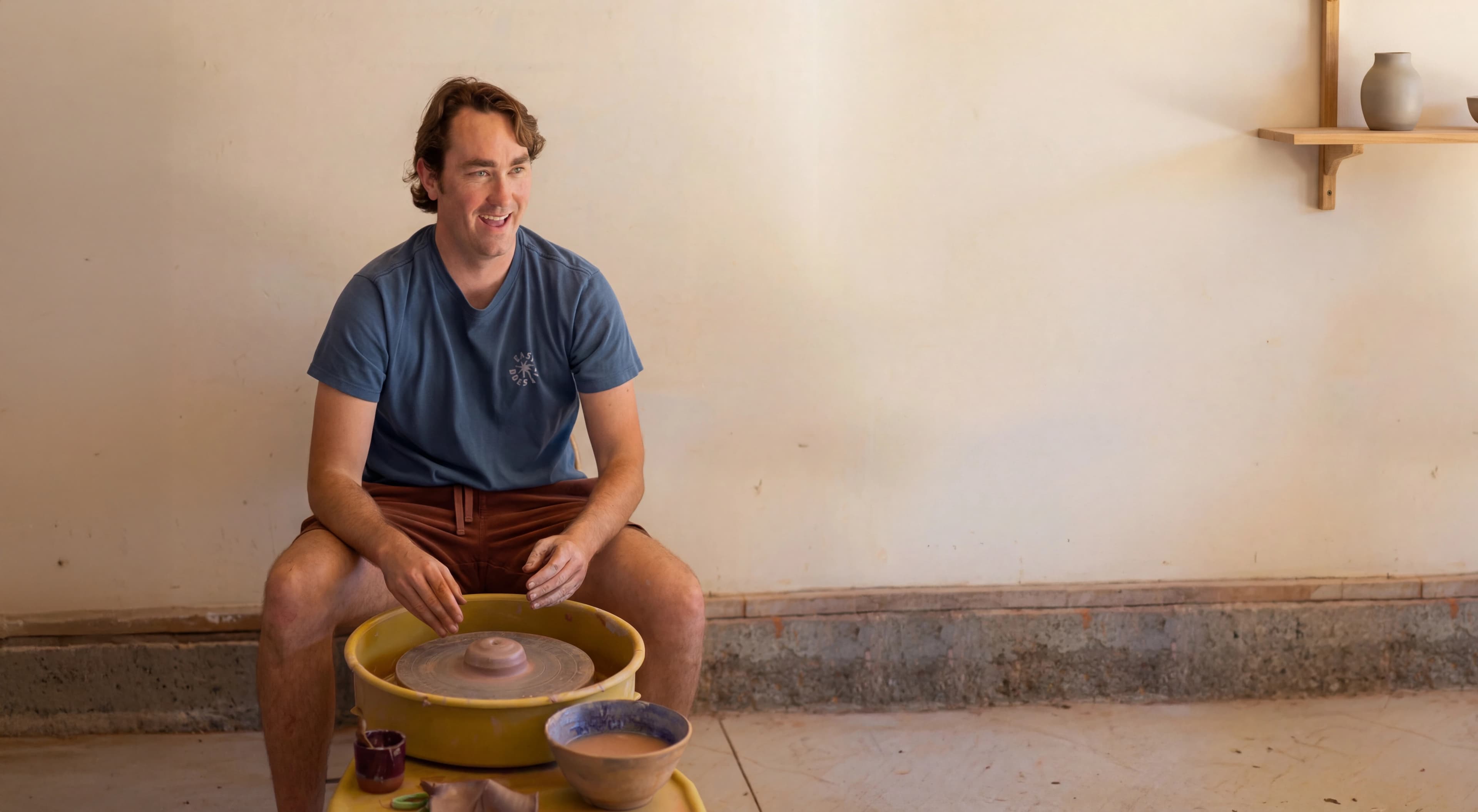Shane Joyer at the pottery wheel in his North Park studio